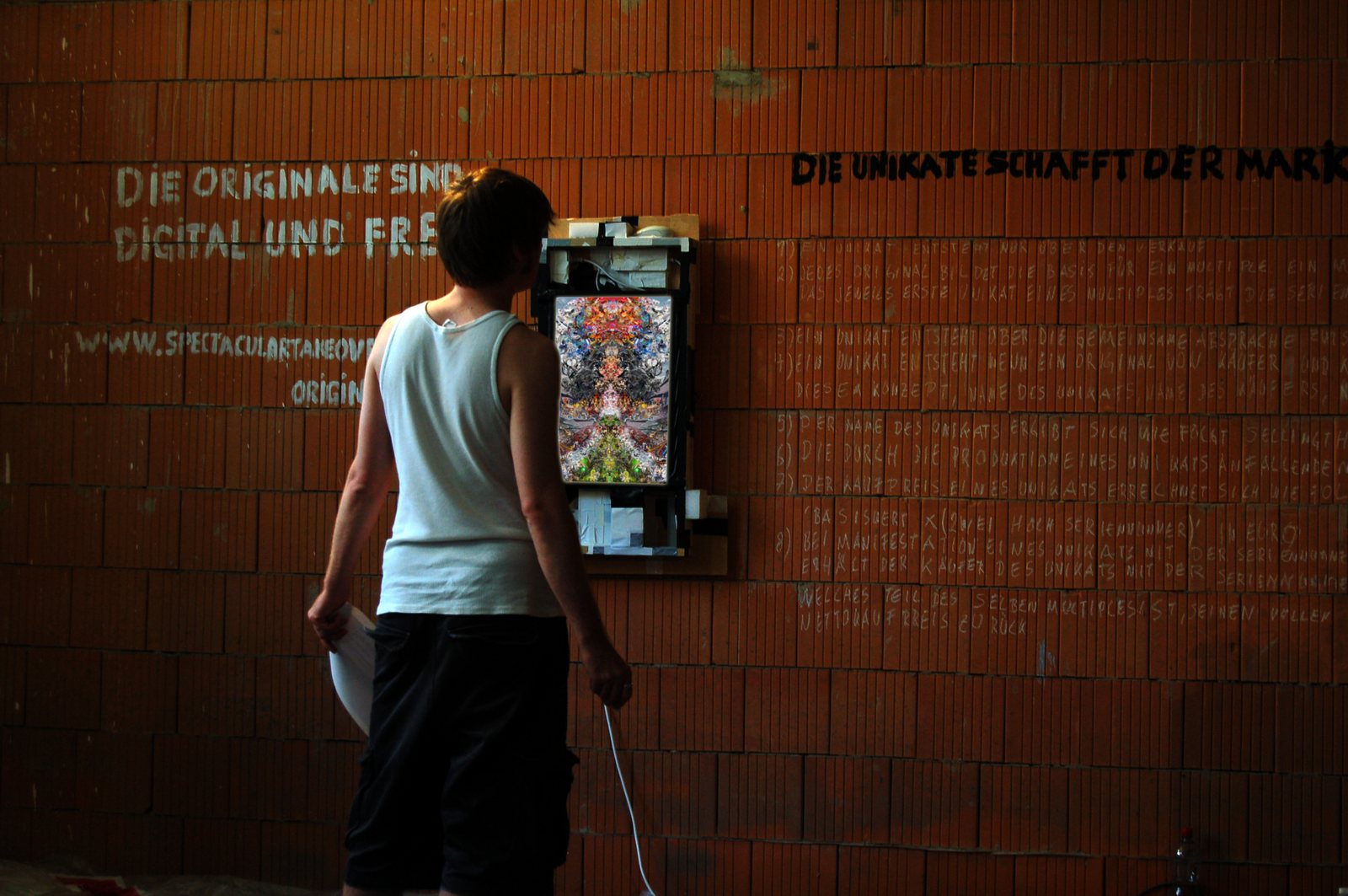 Eexistence Gallery Leipzig 2009 — the digital frame on a brick wall, the rules written in chalk