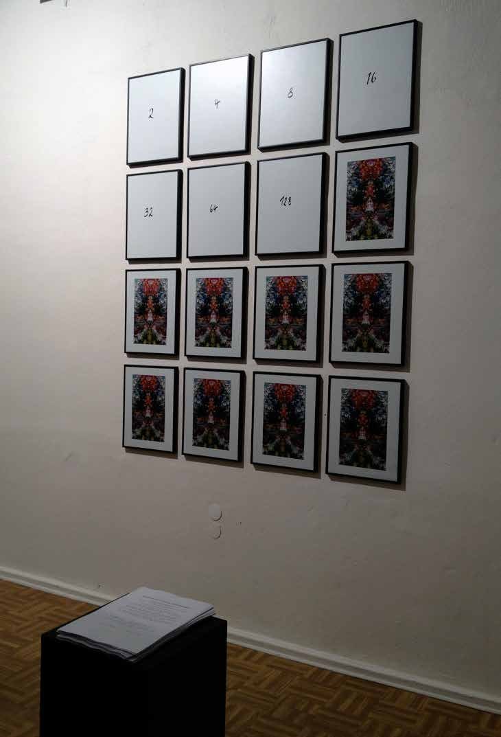 km.temporaer Berlin 2012 — the 4x4 grid mid-happening: emptied frames carry the values 2, 4, 8, 16, 32, 64, 128